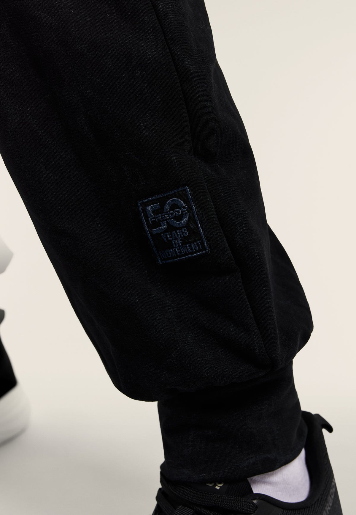 Washed joggers with 50 Years of Movement patch - Black